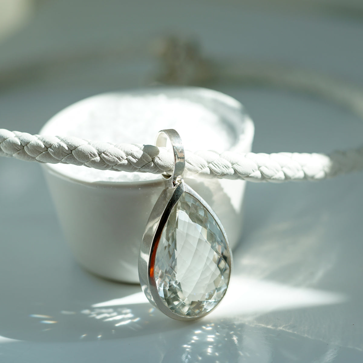 Pear Shaped white Quartz necklace with white braided leather